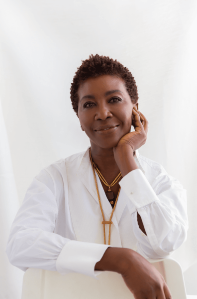 Image may contain Face Happy Head Person Smile Dimples Body Part Neck Accessories Jewelry and Necklace